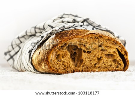 Levain bread on flour powder, side