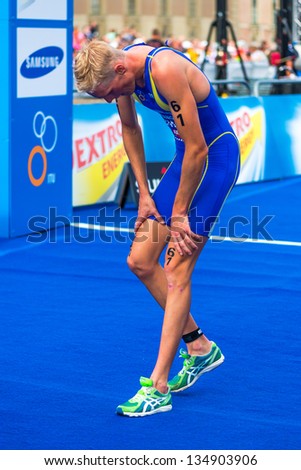 STOCKHOLM - AUG, 24: Per Wangel from Sweden after crossing the finish line of the Mens ITU World Triathlon Series event Aug 24, 2012 in Stockholm, Sweden
