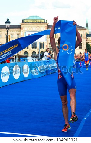 STOCKHOLM - AUG, 24: Jonathan Brownlee crossing the finish line, Javier Gomez in the background in the Mens ITU World Triathlon Series event Aug 24, 2012 in Stockholm, Sweden