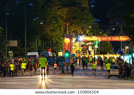 STOCKHOLM - AUG, 17: People gathering to the start of the Midnight Run (Midnattsloppet) event, the start in visible in background. Aug 17, 2013 in Stockholm, Sweden