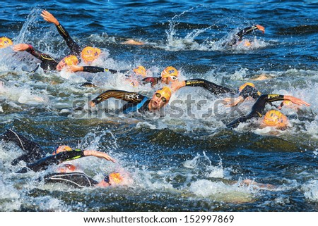 STOCKHOLM - AUG, 25: The chaotic start in the mens swimming in the cold water in the Mens ITU World Triathlon Series event Aug 25, 2013 in Stockholm, Sweden
