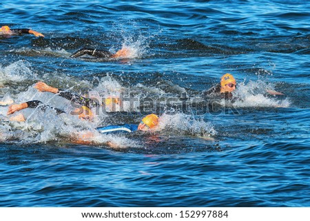 STOCKHOLM - AUG, 25: The chaotic start in the mens swimming in the cold water at the Mens ITU World Triathlon Series event Aug 25, 2013 in Stockholm, Sweden