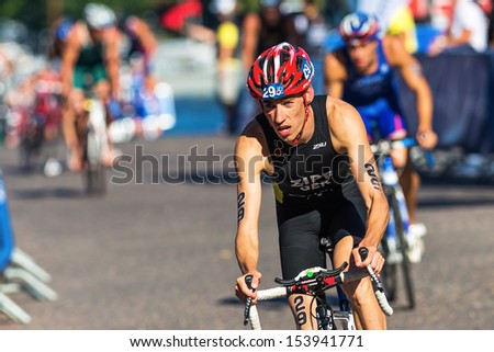STOCKHOLM - AUG, 25: Jonathan Zipfl (GER) leads a group of cyclists in from the transition from the swimming to cycling in the Mens ITU World Triathlon Series event Aug 25, 2013 in Stockholm, Sweden