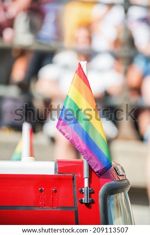 STOCKHOLM - AUG 2: Small rainbow flag ontop of a bus during Stockholm Pride Parade at Hornsgatan. August 2, 2014 in Stockholm, Sweden.