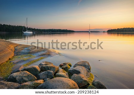 Tranquil scene with sailboats moored for the night, Sweden