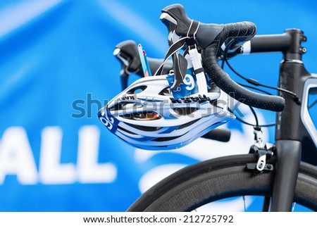 STOCKHOLM - AUG, 23: Closeup of helmet and triathlon bike gear in the transition zone at the Mens ITU World Triathlon Series event Aug 23, 2014 in Stockholm, Sweden