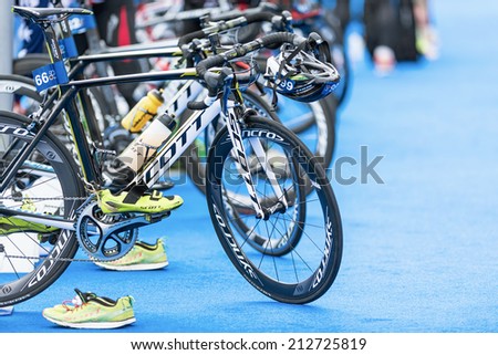 STOCKHOLM - AUG, 23: Row of triathlon bikes with all other equipment at the transition zone in the Mens ITU World Triathlon Series event Aug 23, 2014 in Stockholm, Sweden