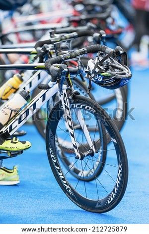 STOCKHOLM - AUG, 23: Front wheels of triathlon bikes with all other equipment at the transition zone in the Mens ITU World Triathlon Series event Aug 23, 2014 in Stockholm, Sweden