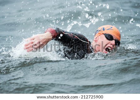 STOCKHOLM - AUG, 23: Closeup of a Conor Murphy in the mens swimming in the cold water at the Mens ITU World Triathlon Series event Aug 23, 2014 in Stockholm, Sweden