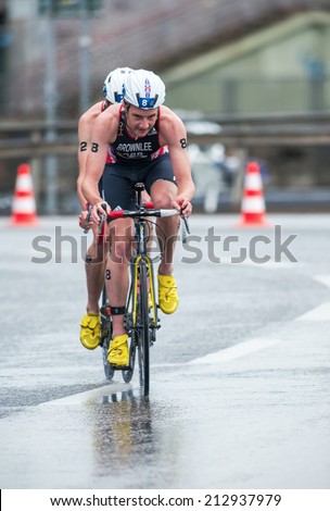 STOCKHOLM - AUG, 23: Alitstair Brownlee with Jonathan on slipstream in the bad weather at the Mens ITU World Triathlon Series event August 23, 2014 in Stockholm, Sweden