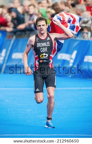 STOCKHOLM - AUG, 23: Winner Jonathan Brownlee crossing the finish line and win the Mens ITU World Triathlon Series event August 23, 2014 in Stockholm, Sweden. Jonathan Brownlee won the race.