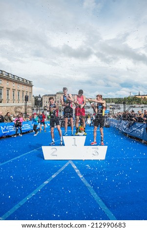 STOCKHOLM - AUG, 23: Celebrations with the overall leader Javier Gomez in the Mens ITU World Triathlon Series event August 23, 2014 in Stockholm, Sweden. Alistair Brownlee got the second place.