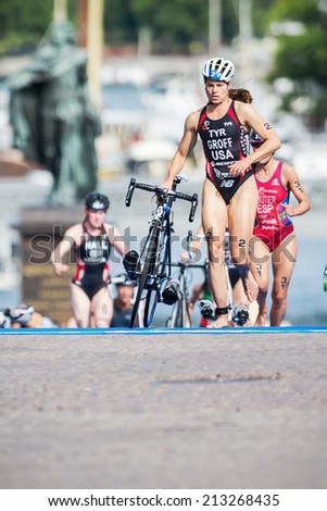 STOCKHOLM - AUG, 23: Sarah Groff from USA running in the transition area to the cycling at the Womans ITU World Triathlon Series event August 23, 2014 in Stockholm, Sweden