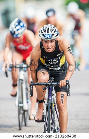 STOCKHOLM - AUG, 23: Anja Knapp from Germany fixing her shoes after the transition to cycling at the Womans ITU World Triathlon Series event August 23, 2014 in Stockholm, Sweden