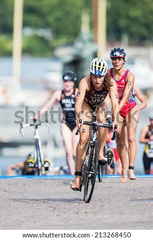 STOCKHOLM - AUG, 23: Sarah Groff from USA first out from the transition to cycling at the Womans ITU World Triathlon Series event August 23, 2014 in Stockholm, Sweden