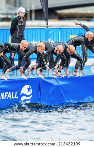 STOCKHOLM - AUG, 23: Triathletes starting in the womens swimming in the cold water at the Woman ITU World Triathlon Series event Aug 23, 2014 in Stockholm, Sweden
