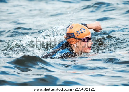 STOCKHOLM - AUG, 23: Closeup of a triathlete Natalie Milne from Great Britain swimming in the cold water at the Womans ITU World Triathlon Series event August 23, 2014 in Stockholm, Sweden