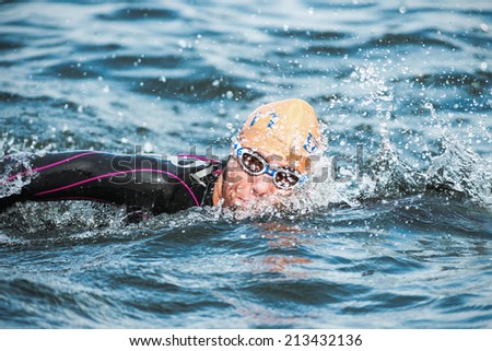 STOCKHOLM - AUG, 23: Charlotte Benin from Italy swimming in the cold water at the Womans ITU World Triathlon Series event August 23, 2014 in Stockholm, Sweden