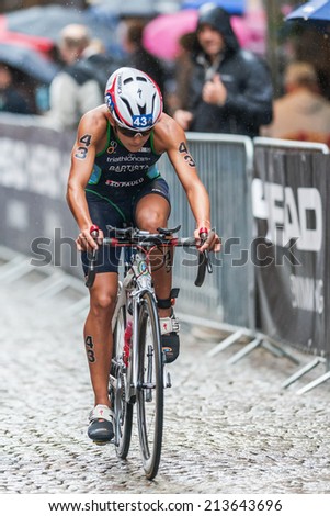 STOCKHOLM - AUG, 23: Luisa Baptista from Brasil cycling in the rain at the Womans ITU World Triathlon Series event August 23, 2014 in Stockholm, Sweden