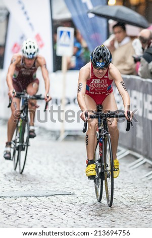 STOCKHOLM - AUG, 23: Alexandra Razarenova from Russia cycling in the rain at the Womans ITU World Triathlon Series event August 23, 2014 in Stockholm, Sweden