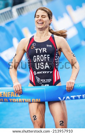 STOCKHOLM - AUG, 23: Happy winner Sarah Groff from USA crossing the finish line in the Womens ITU World Triathlon Series event  Aug. 23, 2014 in Stockholm, Sweden