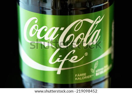 Stockholm, Sweden - Sep 23, 2014: Coca Cola Pet bottle in the new green \