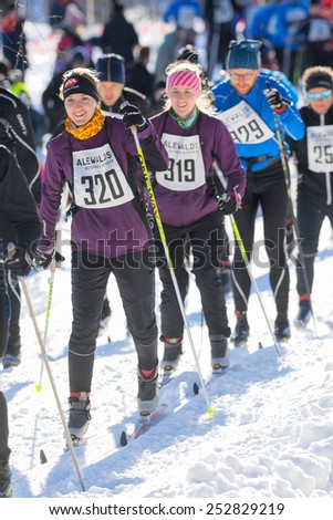 STOCKHOLM - FEB 15: Two happy women ski runners in the Stockholm ski marathon in cross country skiing, february 15, 2015 in Stockholm, Sweden. Stockholm Ski Marathon 46 km