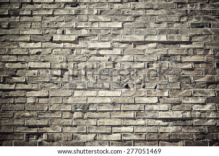 Background of old vintage brick wall in a vintage look, filter applied in light yellow