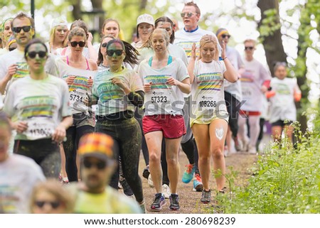 STOCKHOLM, SWEDEN - MAY 23: People running at Stockholm Color Run in Tantolunden or Tanto on May 23, 2015. People from all walks of life participated in the run.