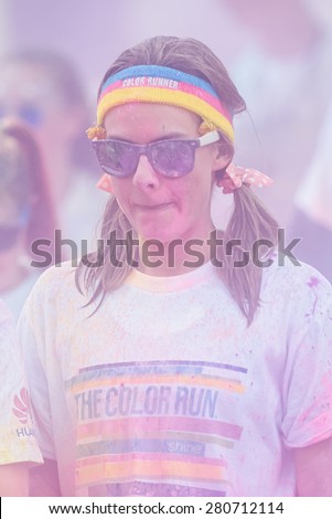 STOCKHOLM, SWEDEN - MAY 23: Woman with colorful fillet at Stockholm Color Run in Tantolunden or Tanto on May 23, 2015. People from all walks of life participated in the run.