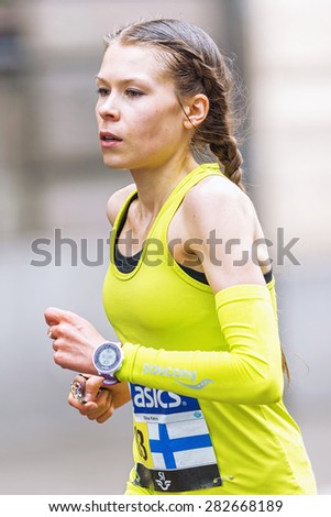 STOCKHOLM - MAY 30: Closeup of woman from Finland in ASICS Stockholm Marathon 2015. May 30, 2015 in Stockholm, Sweden. Runners from 101 nations were registered in 2015
