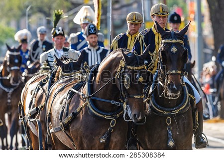 STOCKHOLM - JUN 06, 2015: Swedish Royal carriage with the royal family with Royal guards on the way to celebrate swedish national day.
