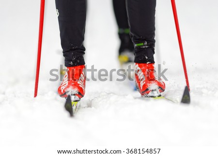 STOCKHOLM, SWEDEN - JAN 24, 2016: Closeup of ski runners fet and legs at Ski Marathon in nordic skiing classic style.