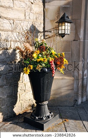 Ornamental vase with flowers in autumn