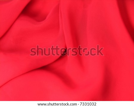 A fine texture of rich red silk as a background. A natural material