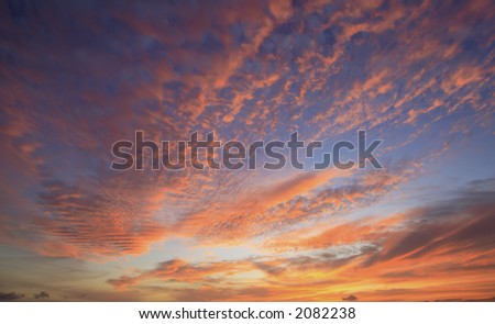 Hawaiian sunset sky with deep blue and orange colors taken in horizontal format