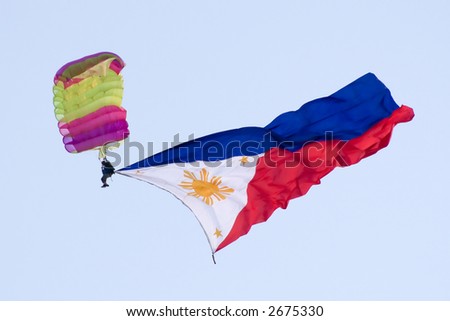 stock photo Philippine flag attached to a skydiver during the 