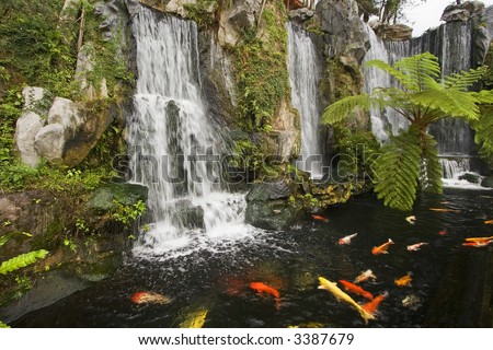 stock photo Koi fish pond with waterfalls in a Chinese Buddhist temple in 