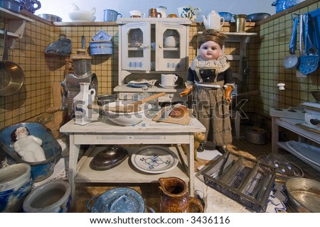 miniature of a kitchen with a cook and her cat