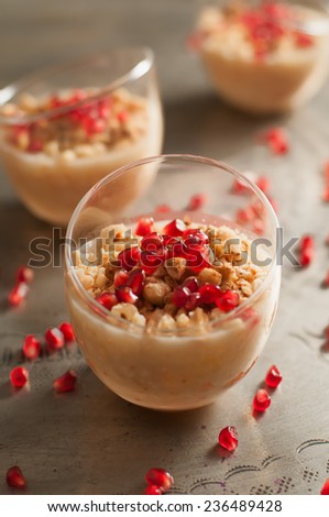 ashura or pudding Turkish dessert Ashura, Noah\'s pudding, with pomegranate seeds and walnuts