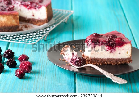 sliced homemade blackberry cheesecake