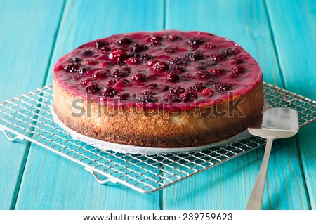 homemade blackberry cheesecake whole homemade blackberry cheesecake on turquoise wooden table