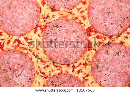 Closeup of uncooked, frozen pizza.
