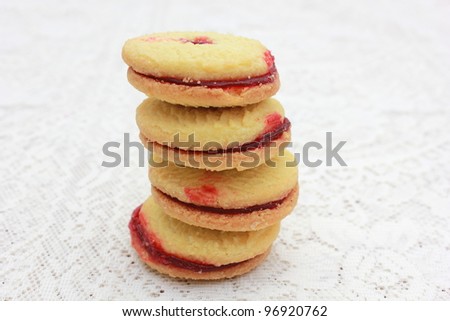 Jam shortbread biscuits on a lace table cloth