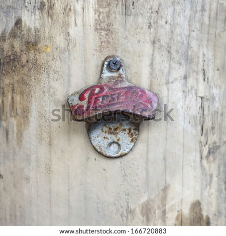 BANGKOK, THAILAND - DEC 5 : Old bottle opener with the logo of Pepsi Cola on December 5, 2013 in Bangkok, Thailand. It is a carbonated soft drink sold in stores and restaurants in Thailand.