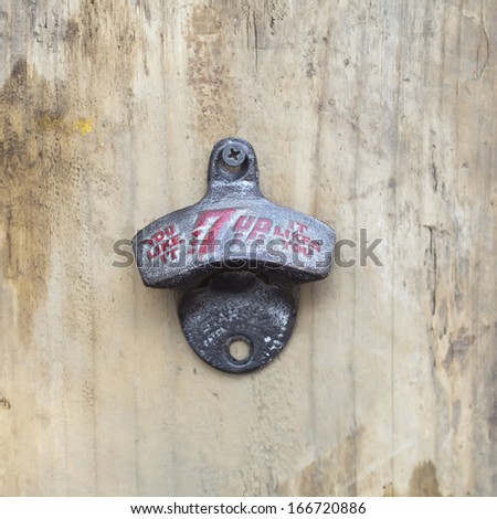 BANGKOK, THAILAND - DEC 5 : Old bottle opener with the logo of 7up on December 5, 2013 in Bangkok, Thailand. It is a carbonated soft drink sold in stores and restaurants in Thailand.