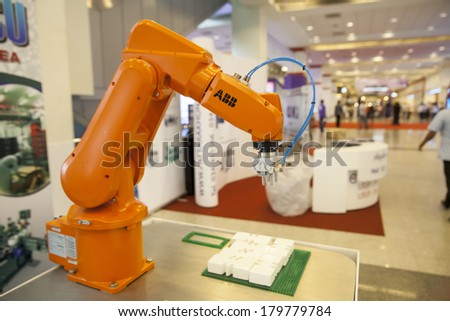 BANGKOK, THAILAND - MARCH 1:An industrial robot hands help to work hard.MARCH 1,2014 in Bangkok,Thailand.