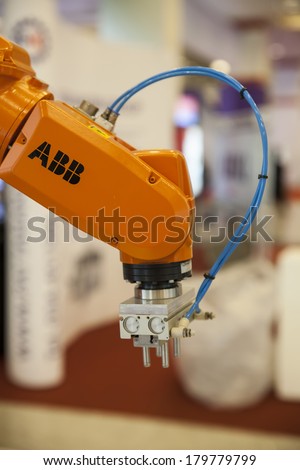 BANGKOK, THAILAND - MARCH 1:An industrial robot hands help to work hard.February MARCH 1,2014 in Bangkok,Thailand.