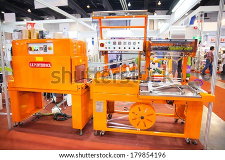 BANGKOK, THAILAND - MARCH 1:The machine food wrapping in Thailand Industrial fair 2014 and Food Pack.MARCH 1,2014 in Bangkok,Thailand