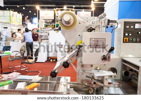 BANGKOK, THAILAND - February 3:The machine food wrapping in Thailand Industrial fair 2014 and Food Pack.February 3,2014 in Bangkok,Thailand.